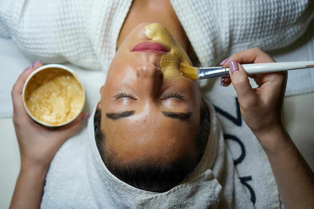 Woman doing facial mask Photo by John Tekeridis